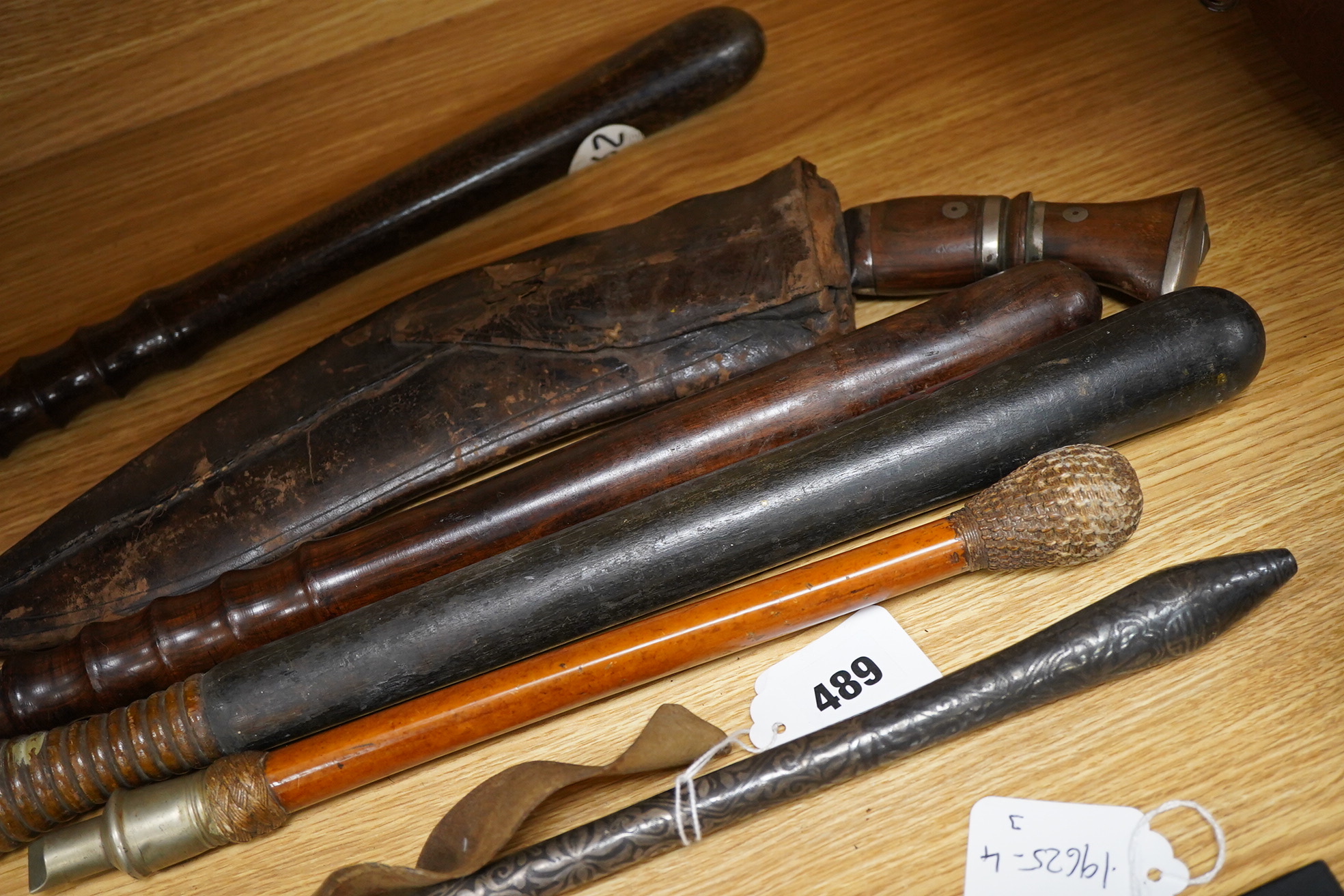 Three truncheons to include a Victorian painted example, a kukri, etc., painted truncheon 45cm